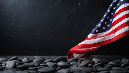 American flag and pebbles on black background, space for textの素材
