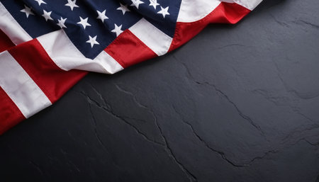 American flag on black stone background. Top view with copy space.の素材