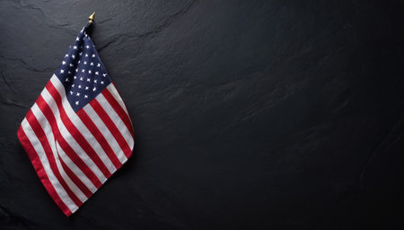 American flag on black stone background. Top view with copy space.の素材