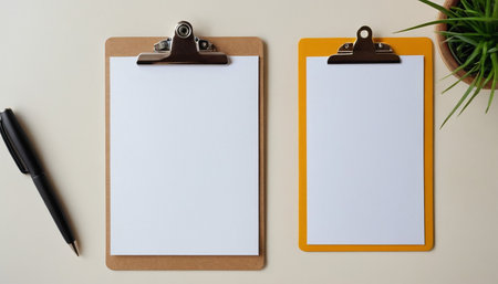 Clipboard with blank paper sheet and pen on white background.の素材