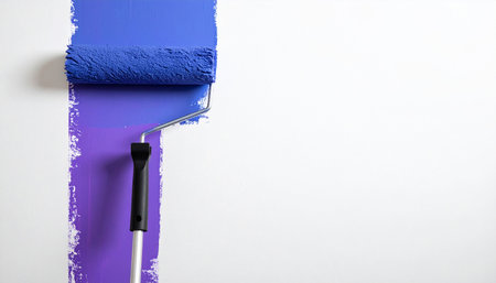 Painting the wall with a roller, isolated on a white backgroundの素材