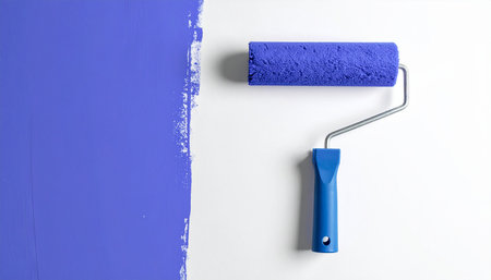 Paint roller on a white background. Painting the walls in blue.の素材