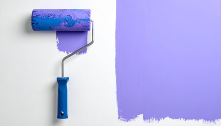 Roller with paint on white background, top view. Painting conceptの素材