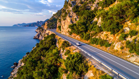 Aerial view of the road to the sea at sunset in Montenegroの素材