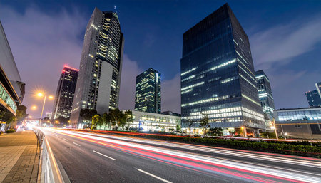 the light trails on the modern building background in shanghai chinaの素材