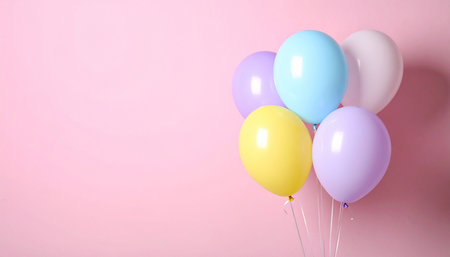 Colorful balloons on pink background, closeup. Space for textの素材