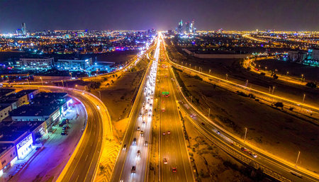 Aerial view of highway in Dubai at night, United Arab Emiratesの素材