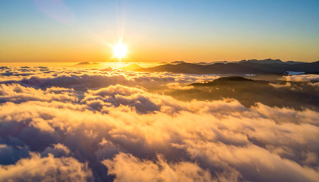 Sunrise above the clouds in the morning. Beautiful nature background.の素材