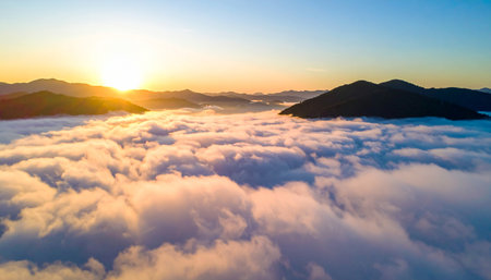 Aerial view of beautiful sunrise above the clouds at Phu Chi Fa, Chiang Rai, Thailandの素材