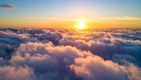 Aerial view of white clouds and blue sky at sunset or sunriseの素材