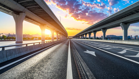Asphalt road and modern bridge at sunset in Shanghai,China.の素材