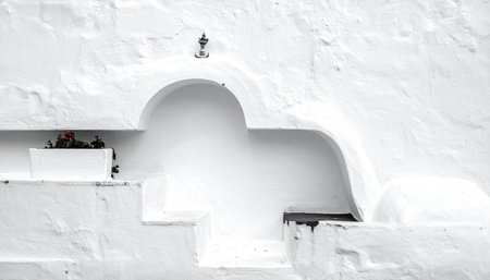 White wall with a window in Santorini island, Greece.の素材