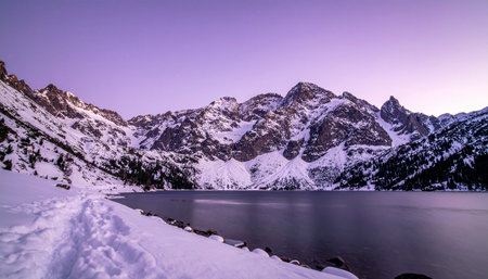 Mountain lake in the winter at sunset. Landscape of the mountains.の素材