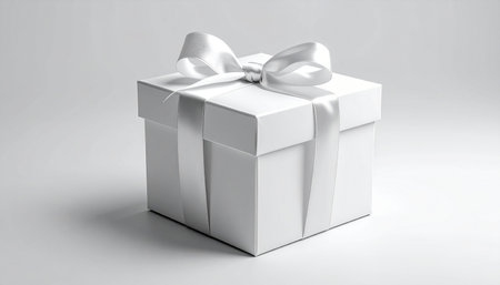 White gift box with silver ribbon on white background. 3D renderingの素材