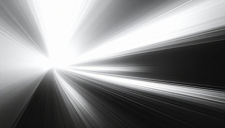 Abstract monochrome light streaks radiating from a bright central point, creating a powerful sense of speed and motion.の素材