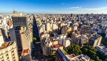 Wide aerial view of a vast urban landscape filled with countless buildings and streets stretching to the horizon.の素材