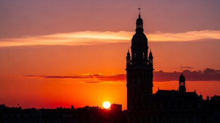 Sunset over the City Hall in Brussels, Belgium. Beautiful sunset over the city.の素材