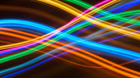 Abstract light lines background. Texture of colorful neon lights. Futuristic technology style.の素材