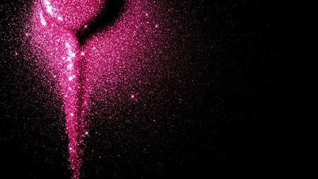 Pink glitter sparkles on black background. Dust particles fly in space.の素材