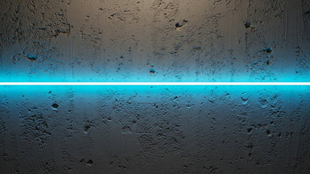 a close-up of a rough, textured concrete wall. A single, bright cyan neon light strip runs horizontally across the center of the frame, casting a vibrant glow and sharp illumination. The texture of the concrete is clearly visible, with its imperfections and variations adding depth to the surface. The contrast between the dark, industrial texture of the wall and the clean, electric glow of the neon light creates a modern and atmospheric visual.の素材