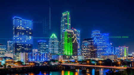 A vibrant and energetic depiction of the Austin, Texas skyline at night. Numerous skyscrapers are illuminated with striking blue and green neon lights, creating a futuristic and dynamic urban landscape. A bridge crosses a body of water, with its lights and the city's glow reflecting on the surface. Abstract digital are overlaid, suggesting technology and data. The dark sky is dotted with stars, contrasting with the intense city illumination.の素材