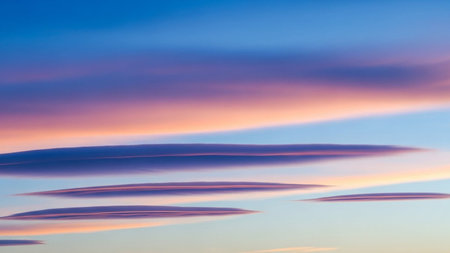 Textures showing lenticular clouds in a vibrant sunset sky with hues of pink orange and blue colors keywords:...の素材
