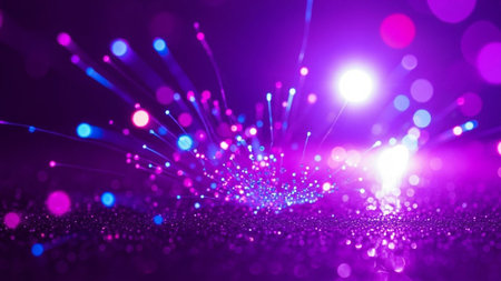 An abstract composition a dense cluster of glowing fiber optic strands emitting vibrant purple and blue light. Numerous out-of-focus bokeh circles in shades of pink and purple add a dreamy, ethereal to the scene. The conveys a sense of energy, technology, and dynamic movement against a dark, sparkling background.の素材