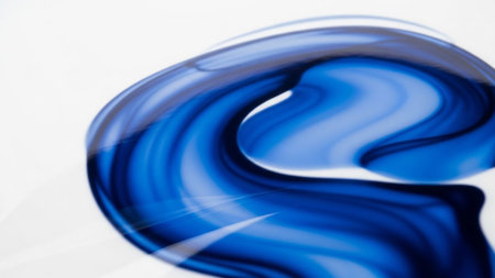 Abstract swirling deep blue fluid with glossy translucent texture on a clean white background with subtle light...の素材