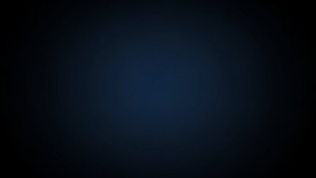 A deep, dark blue gradient background with a subtle vignette effect. The color transitions smoothly from a rich navy blue in the center to a darker, almost black hue at the edges. This creates a soft, atmospheric focus and a sense of depth. The background is clean, minimalist, and versatile, offering ample copy space for text or Its and tranquil mood makes it a wide range of applications, including presentations, web and projects.の素材