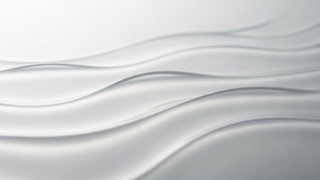 Ethereal white and silver waves of translucent flow gently with subtle light and shadow, creating a serene abstract...の素材