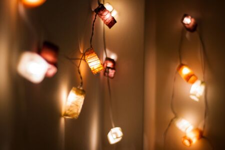 Paper light garland on a wallの写真素材