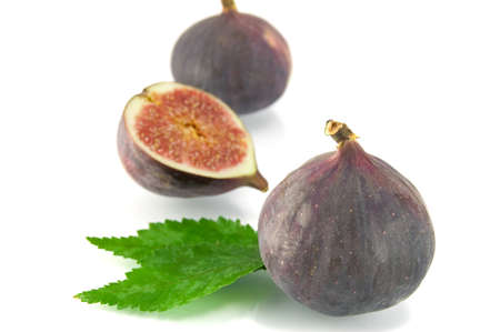ripe fig isolated on a white background の写真素材