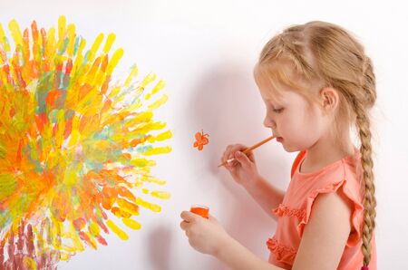 cute little girl draws a pictureの写真素材