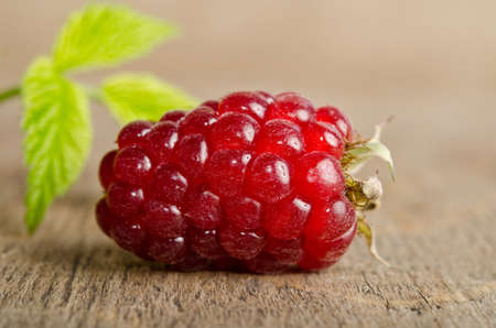 Ripe raspberry  on wooden table