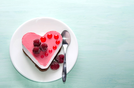 nice small cake in the form of heart  on the tableの写真素材