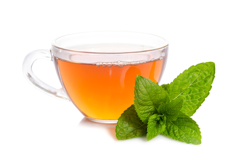 Glass cup of Tea with mint leaves  on tableの写真素材
