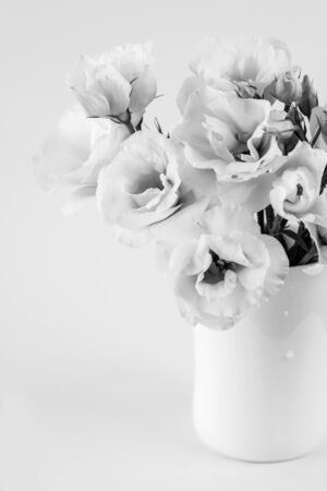 Beauty Eustoma flowers in vase. Black and white photoの写真素材