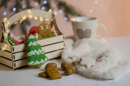 Gingerbread tree, cup and nuts near the box. Christmas decoration.の写真素材