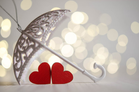 Two red hearts, white umbrellaの写真素材