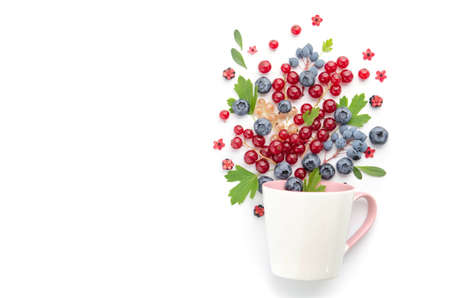 Berry cocktail. Various berries. Currants and blueberries over a white cup.