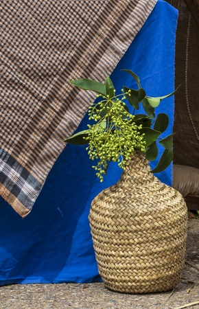 still life straw natural container with plantsの写真素材