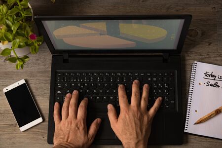 work at home with computer with phone notebook plantの写真素材