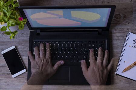 work at home with computer with phone notebook plantの写真素材