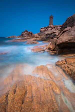 Ploumanach Lighthouse France pink granite coast big stones & seaの写真素材