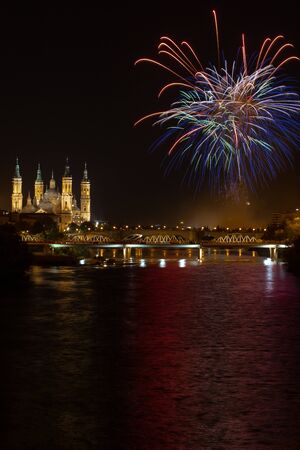 Fireworks in cathedral of our lady of the pilar 13 october 2019 reflected in the ebro riverの写真素材