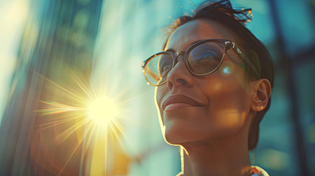 Portrait of a beautiful woman in glasses on a background of skyscrapers. Generative Ai.の素材