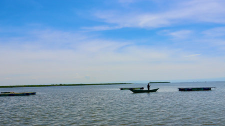 Fisherman boat on the lake with blue sky background, Kenyaの写真素材