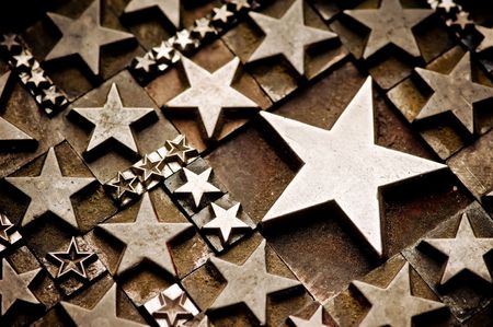 A random arrangement of letterpress stars with narrow depth of field. Part of a series of letterpress backgroundsの写真素材