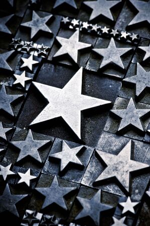 A random arrangement of letterpress stars with narrow depth of field. Part of a series of letterpress backgroundsの写真素材