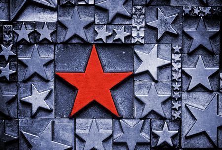 A random arrangement of letterpress stars with narrow depth of field. Part of a series of letterpress backgroundsの写真素材